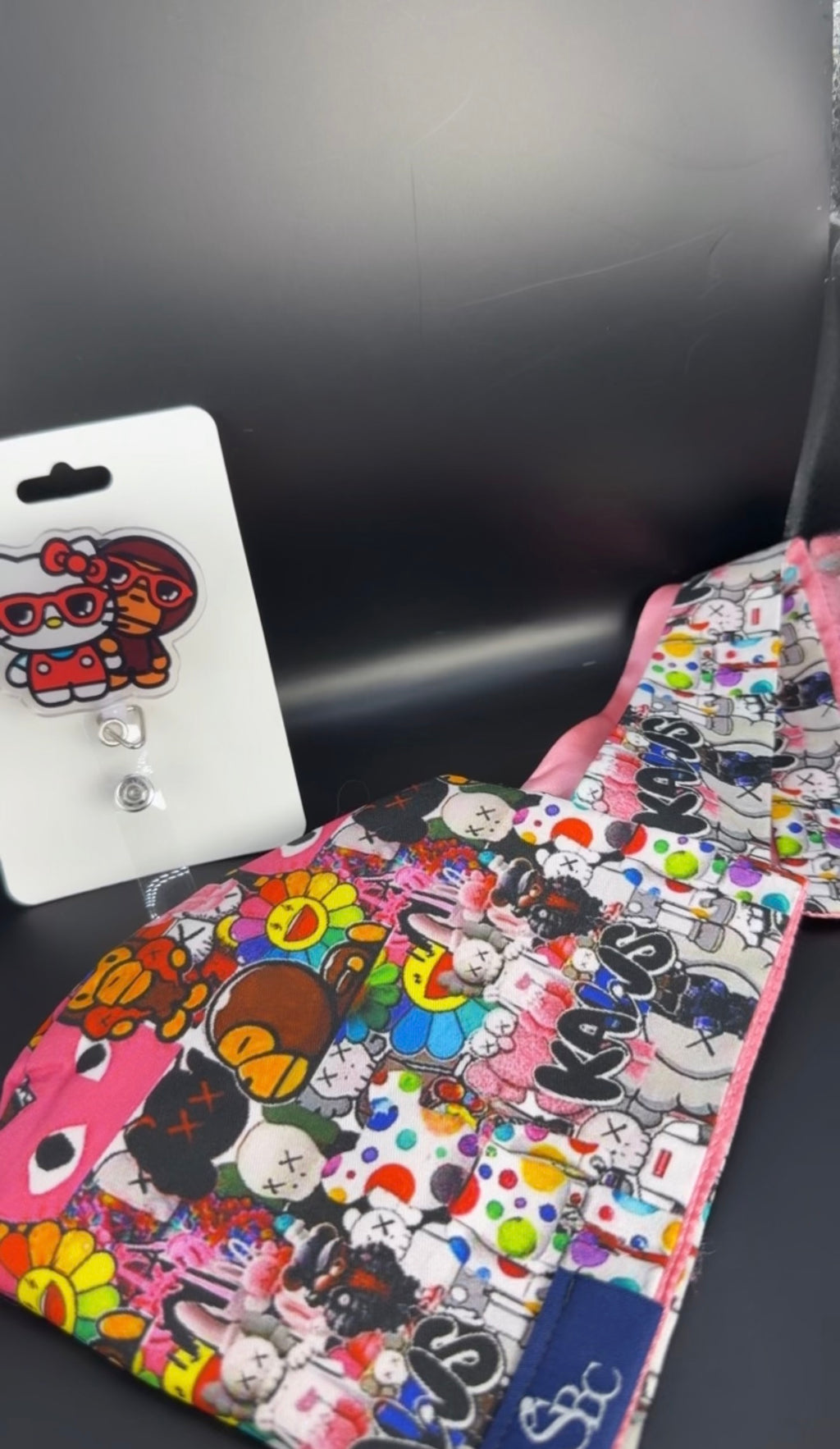 Kaws & Friends Scrub Cap & Badge Reel